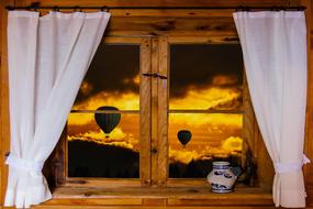 view from the old wooden window to hot balloons