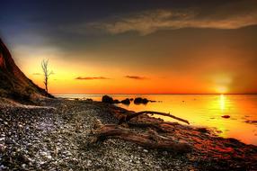 Beautiful coast of MÃ³n in Denmark, at colorful and beautiful sunrise with clouds