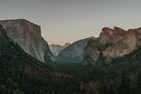 Landscape of the beautiful mountains around the fire trees, at beautiful and colorful dawn