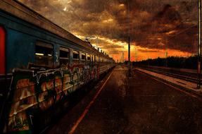 abandoned train on the railroad during sunset