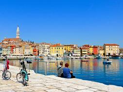 couple with bicycles on the promenade in croatia