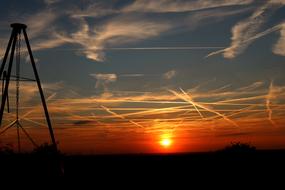 airplane trucks in Sunset Sky over countryside