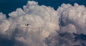 Plane on Cloud Sky