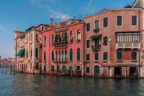 canal near the building with pink walls in venice