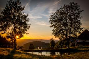 Beautiful and colorful landscape with the water among the mountains and plants, in Triberg, Germany, at colorful and beautiful sunset