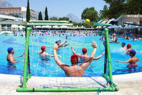 people playing Water Ball in outdoor pool