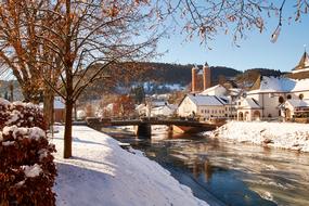 Beautiful, snowy landscape with plants, buildings and Bertradaburg in Germany, in the winter