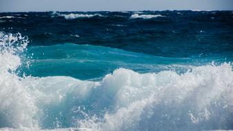 foamy turquoise waves close up