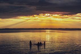 landscape of children on Lake at Sunset