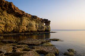 Beautiful and colorful coast of Cavo Greko, in Cyprus, Greece, at beautiful and colorful sunset