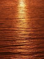 Close-up of the beautiful Calm sea with ripple, at colorful and beautiful sunset