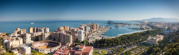 city with skyscrapers near the sea in spain