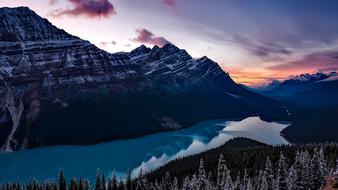 Beautiful landscape with the lake and mountains with trees, at colorful and beautiful sunset, in Washington, USA