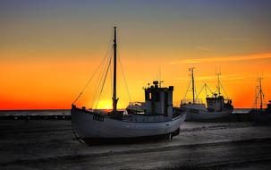 ship on the background of red and yellow sunset, denmark