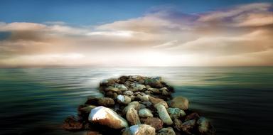 stones on the coastline as a photomontage