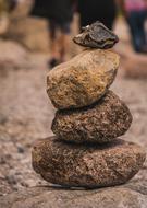 a tower of stones on a blurred background