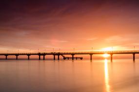 bridge on the sea at sunset