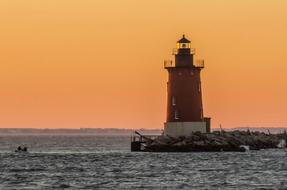 Beautiful landscape with Breakwater East End lighthouse in Delaware, USA, at colorful and beautiful, gradient sunset