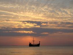 Ship at The Sunset Sea