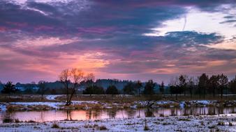 river in winter landscape at dusk