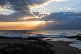 Beautiful Dolphin Coast in South Africa, at colorful and beautiful sunset, among the clouds