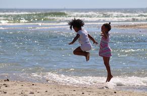 Children Jump on beach