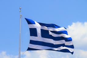 Greek Flag winding at sky