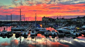 Boats in the marina, at colorful and beautiful sunset with clouds