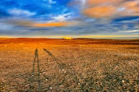 Beautiful and colorful landscape with the shadows of people, in Iceland, at colorful and beautiful sunset