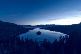 lake tahoe near hills with trees during sunset