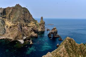 Beautiful and colorful Dokdo Islands, in Korea, at blue sky on background