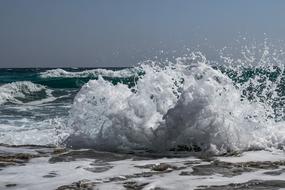 wind makes high waves on a sunny day