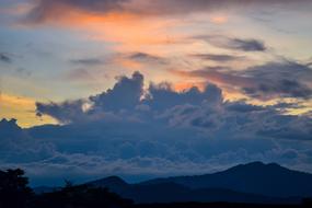 clouds over the mountains of venezuela at dusk