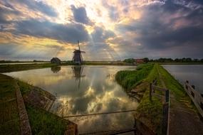 windmill on the shore of a pond in the Netherlands