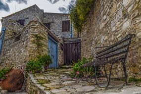 bench by a stone house in vavla village, Cyprus