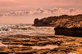 rocks on the coastline at dusk