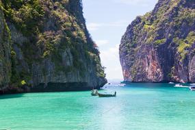 boat in the lagoon among the rocks in thailand