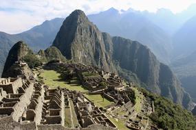 stone buildings on the mountain in peru