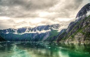 lake near mountains in snow in alaska