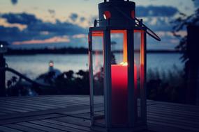 candle in a lantern at romantic twilight