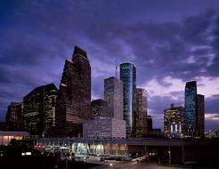 Cityscape of Houston, Texas, USA, with colorful lights, at the dusk with clouds