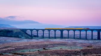 train on ribblehead viaduct at scenic landscape, uk, england, Yorkshire Dales National Park