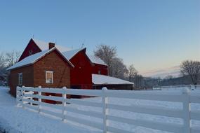 a barn in the winter snow