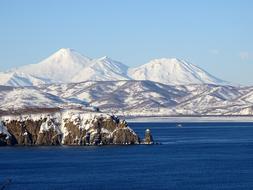 mountains in the snow near the pacific ocean