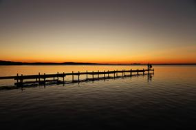 pier by the sea at sunset