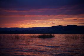 sunset over a lake in switzerland