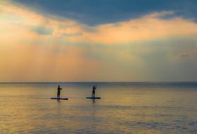 surfers at Sunset Water Dawn