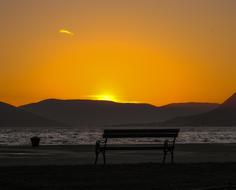 bench on the coast at dusk