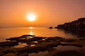 landscape of rocky beach at Sunset Dusk