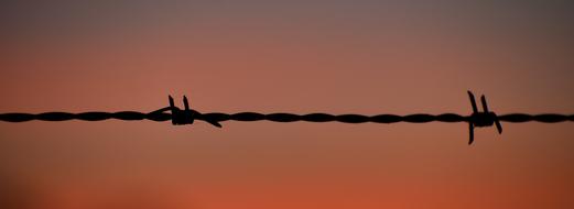 Sunset Silhouette Barb Wire Fence